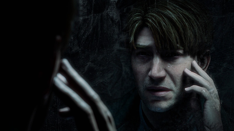 James Sunderland of Silent Hill 2 looks into a mirror.