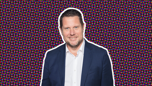 A headshot of Embracer CEO Lars Wingefors on a stylised purple background