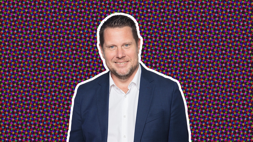 A headshot of Embracer CEO Lars Wingefors on a stylised purple background