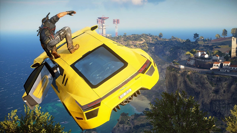 Just Cause 3 protagonist Rico Rodriguez prepares to jump off a flying sports car.