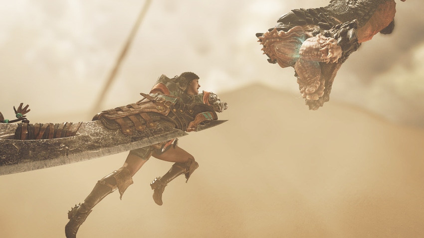 The player character in Monster Hunter Wilds leaps in the air to stab a worm-looking monster.