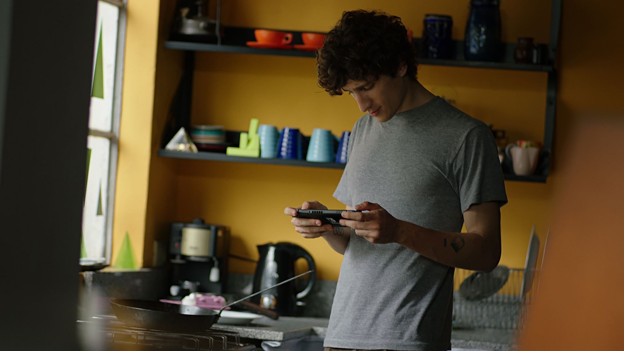 player using a handheld device player using a handheld device