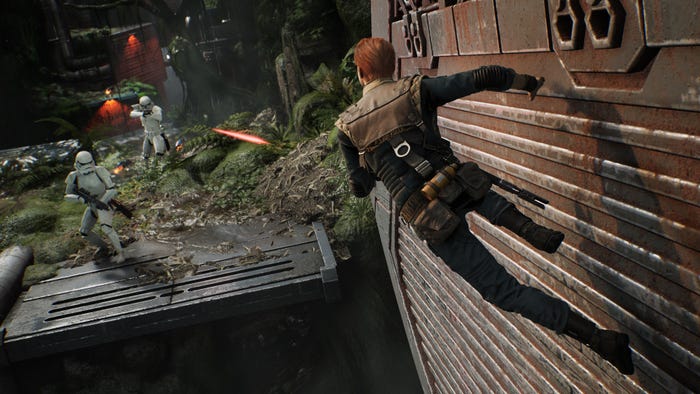 A screenshot from Star Wars Jedi: Fallen Order. Cal Kestis runs on a wall as Stormtroopers shoot at him.