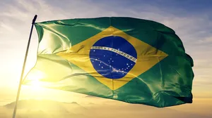 A Brazilian Flag at sunrise. A Brazilian Flag at sunrise.
