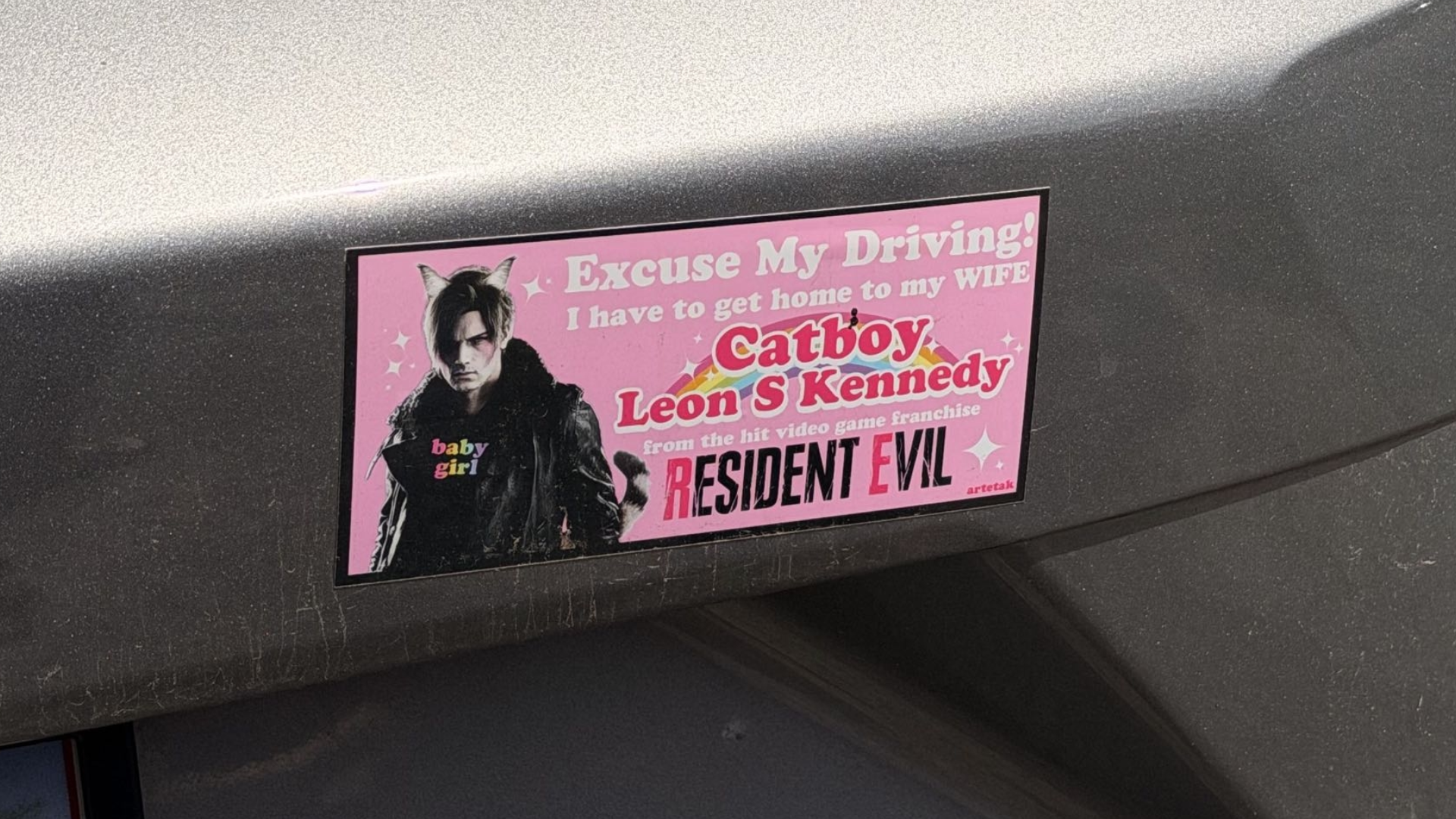 A bumper sticker of Leon Kennedy with cat ears