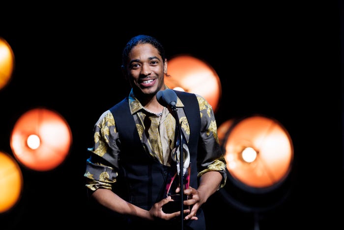 Nadji Jeter holds his DICE Award.