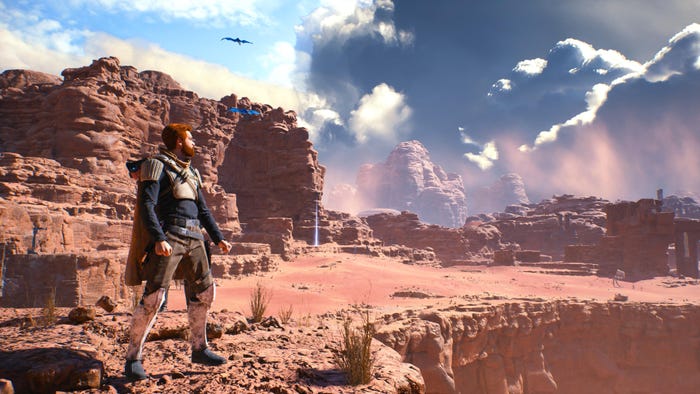 A screenshot from Star Wars Jedi: Survivor. Cal Kestis stands before a desert landscape.
