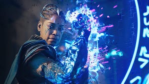 A promotional screenshot from Immortals of Aveum. A magic user named Kirkan holds up her glowing arm.