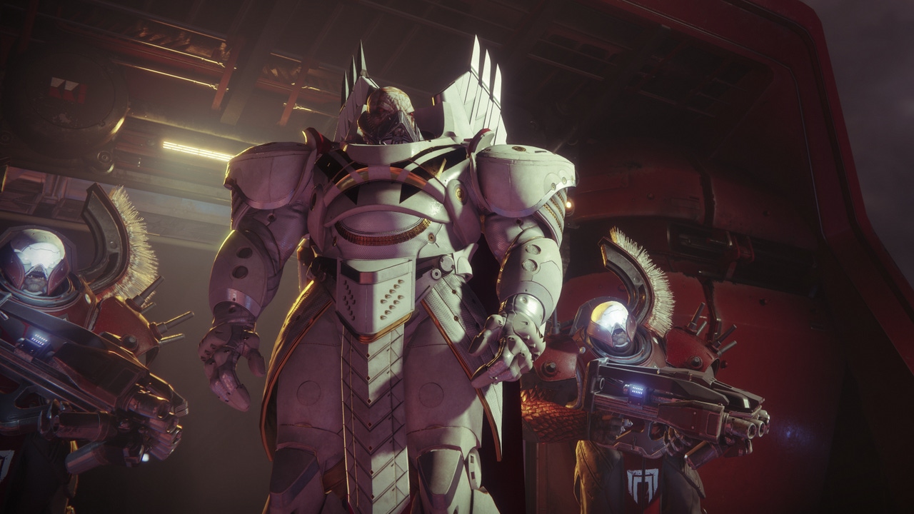 A white-armored alien stands ominously in front of a dark sky. A white-armored alien stands ominously in front of a dark sky.