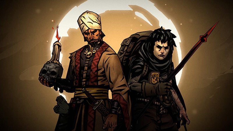 A screenshot of two Darkest Dungeon two characters. One wears a turban and carries a skull, the other is cloaked with a spear.