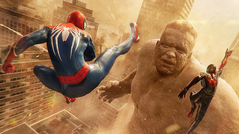 Spider-Man and Spider-Man fighting Sandman in Marvel's Spider-Man 2.