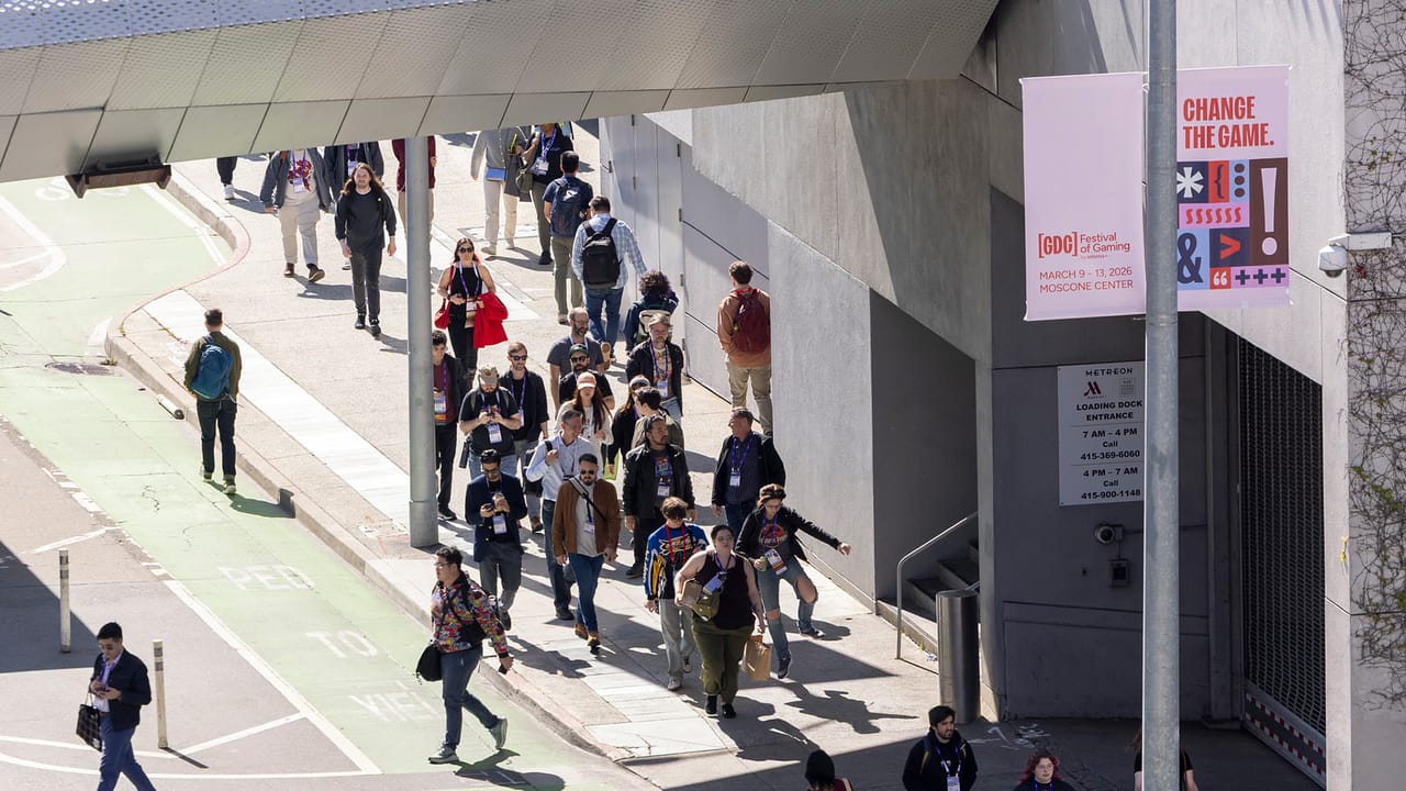 A shot of the GDC crowd, one person does a jump-skip on the street A shot of the GDC crowd, one person does a jump-skip on the street