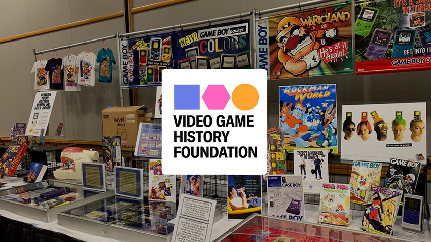The Video Game History Foundation logo overlaid on a photograph of a pop-up video game history exhibit