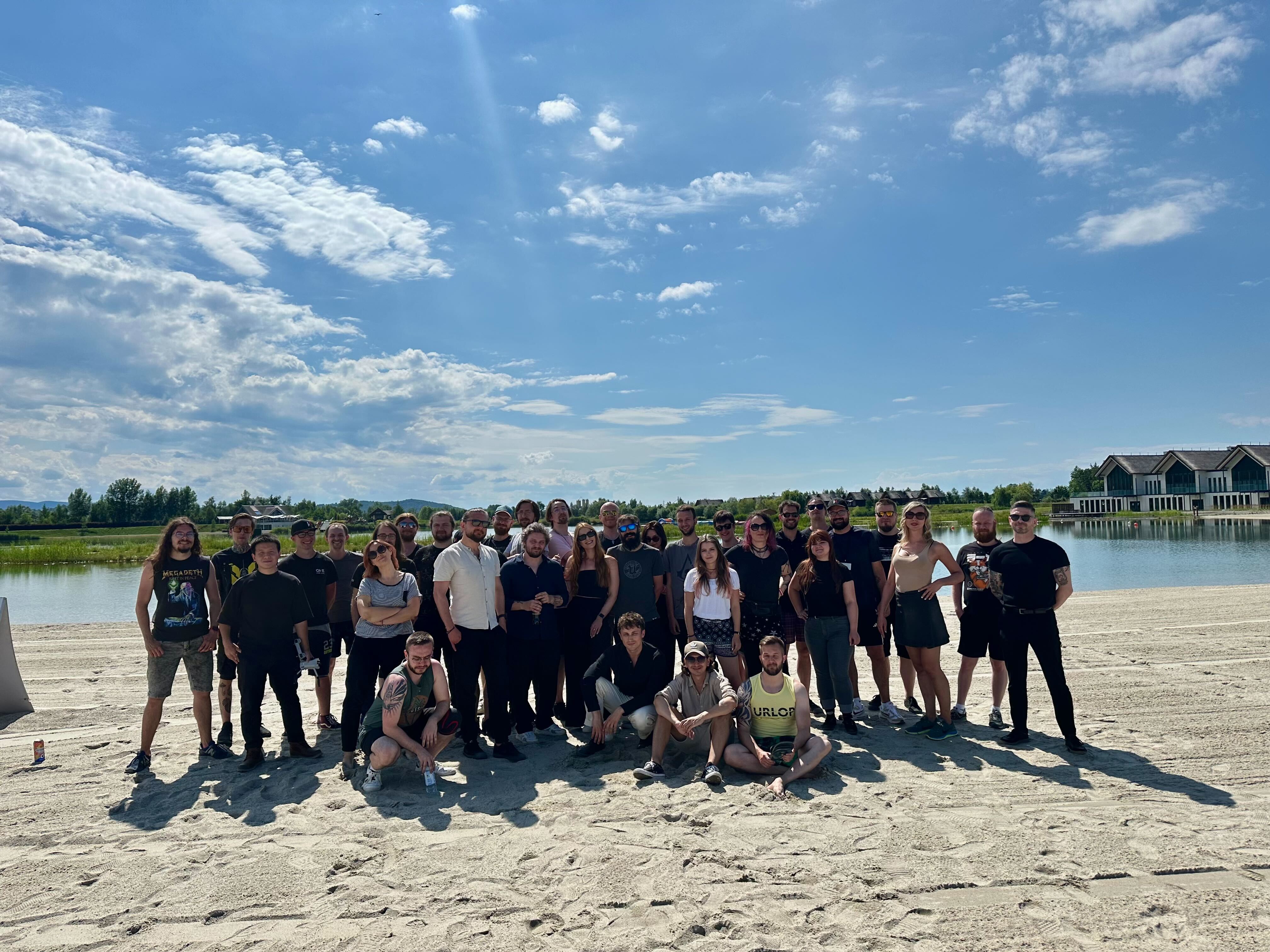 the development team posing on a sunny day