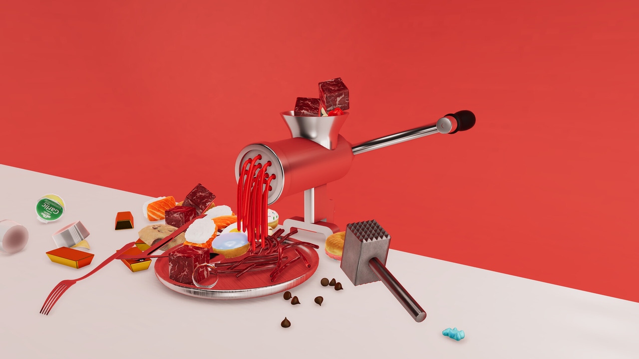 Meat being run through a grinder pours onto a plate. Meat being run through a grinder pours onto a plate.