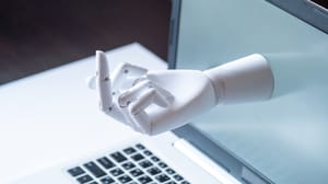 A robotic middle finger emerges from a laptop screen. A robotic middle finger emerges from a laptop screen.