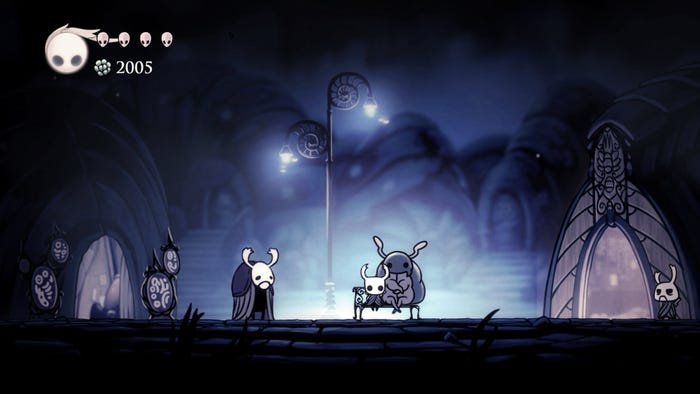 A screenshot from Hollow Knight. The player character sits on a bench next to a large bug.