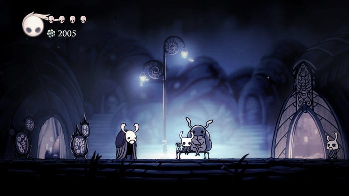A screenshot from Hollow Knight. The player character sits on a bench next to a large bug. A screenshot from Hollow Knight. The player character sits on a bench next to a large bug.