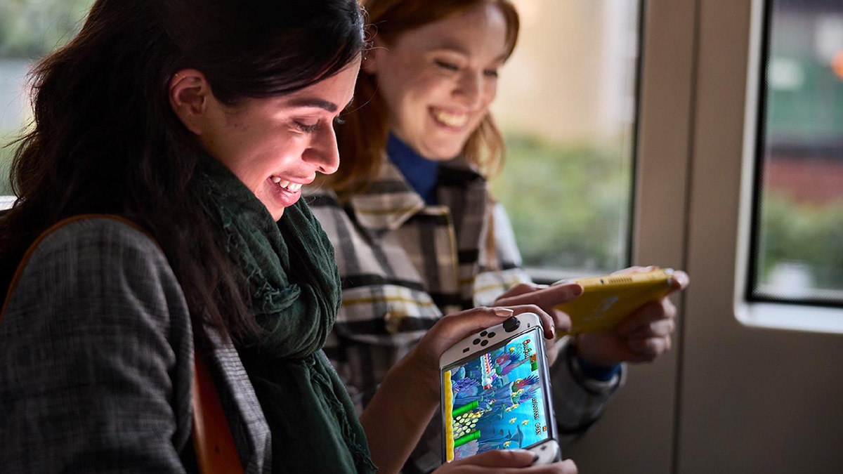 Two people playing the Nintendo Switch Two people playing the Nintendo Switch