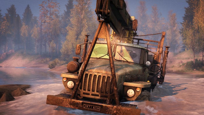 A screenshot from Spintires. A massive truck struggles in the mud.