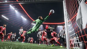 A goalie lunges to stop a ball from going in the net in EA Sports FC 26. A goalie lunges to stop a ball from going in the net in EA Sports FC 26.