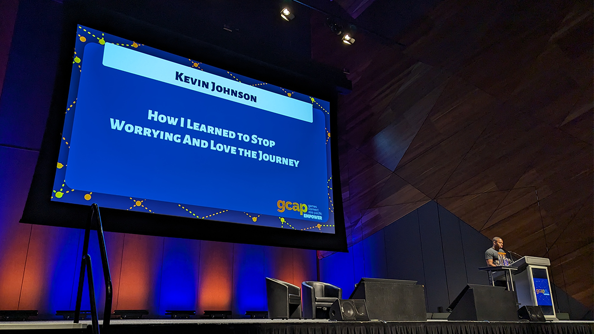 Kevin Johnson speaking on stage at GCAP 2023