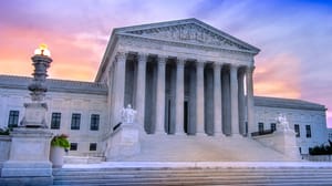 A photo of the US Supreme Court against a blue-and-orange sky. A photo of the US Supreme Court against a blue-and-orange sky.