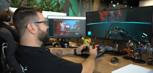 Game director playing Ghostrunner 2 at desk Game director playing Ghostrunner 2 at desk