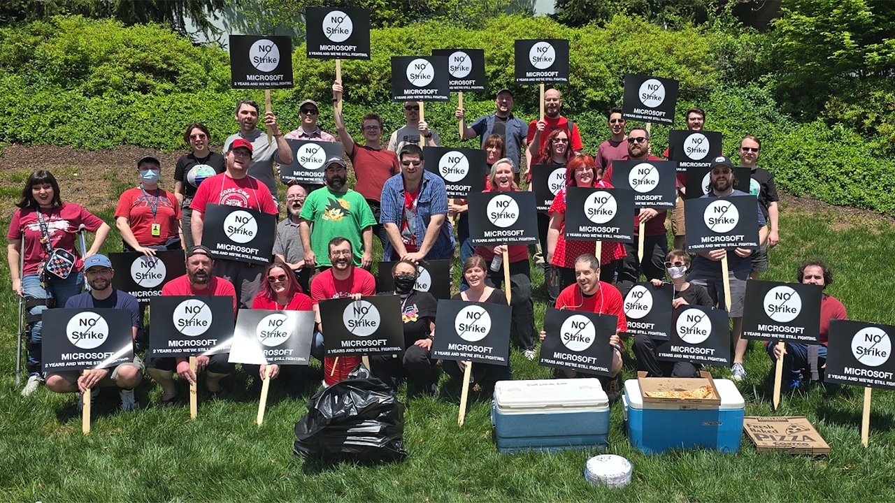 A group of unionised ZeniMax workers holding signs that read 'No Strike: Two years and we're still fighting' A group of unionised ZeniMax workers holding signs that read 'No Strike: Two years and we're still fighting'