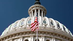 A shot of the American flag in front of the dome on the U.S. Capitol Building A shot of the American flag in front of the dome on the U.S. Capitol Building