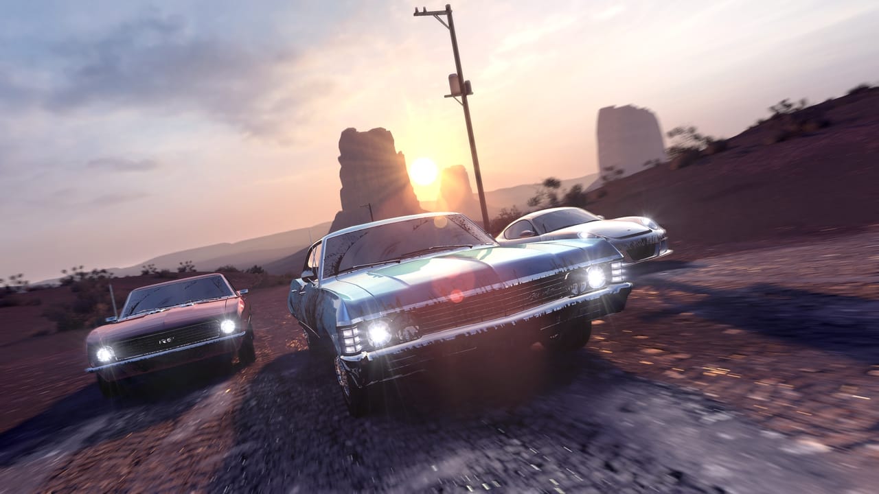 Three cars racing on a dirt path in The Crew Three cars racing on a dirt path in The Crew