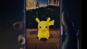 A wild Pikachu appears in Pokemon Go on a smartphone A wild Pikachu appears in Pokemon Go on a smartphone