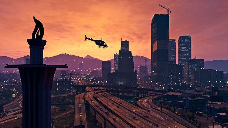 A screenshot of a chopper flying towards a cityscape in Grand Theft Auto V