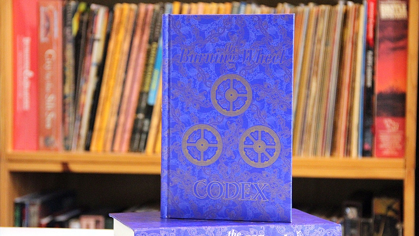 A photograph of the Burning Wheel Codex, which includes additional material for the tabletop RPG