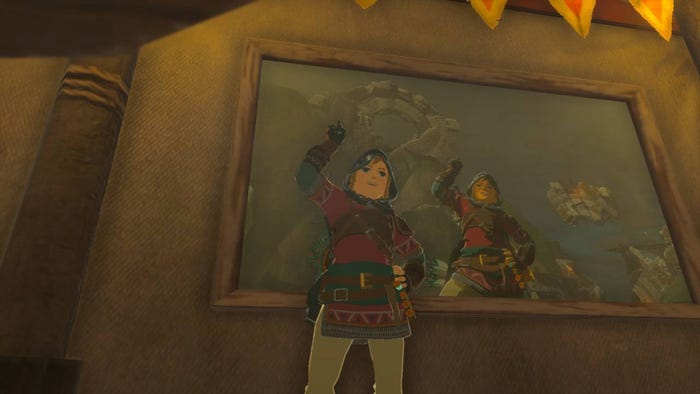 A screenshot from The Legend of Zelda: Tears of the Kingdom. Link points up at a photo of himself pointing up at some ruins.