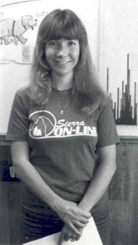 A picture of Roberta Williams, wearing a T-shirt of the original Sierra On-Line logo.