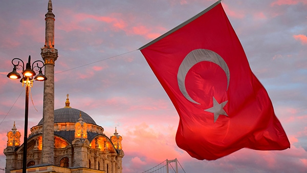 the flag of turkey hanging over Istanbul
