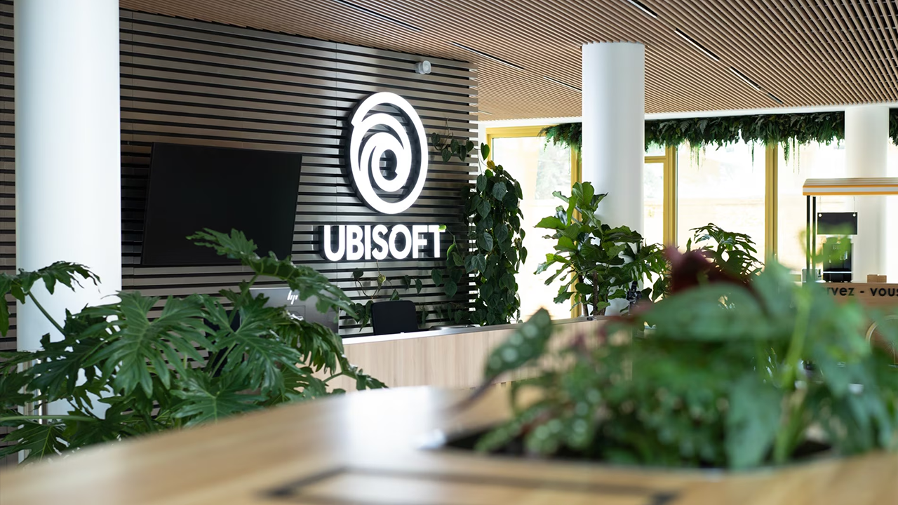 The Ubisoft logo on signage in a company office. The Ubisoft logo on signage in a company office.