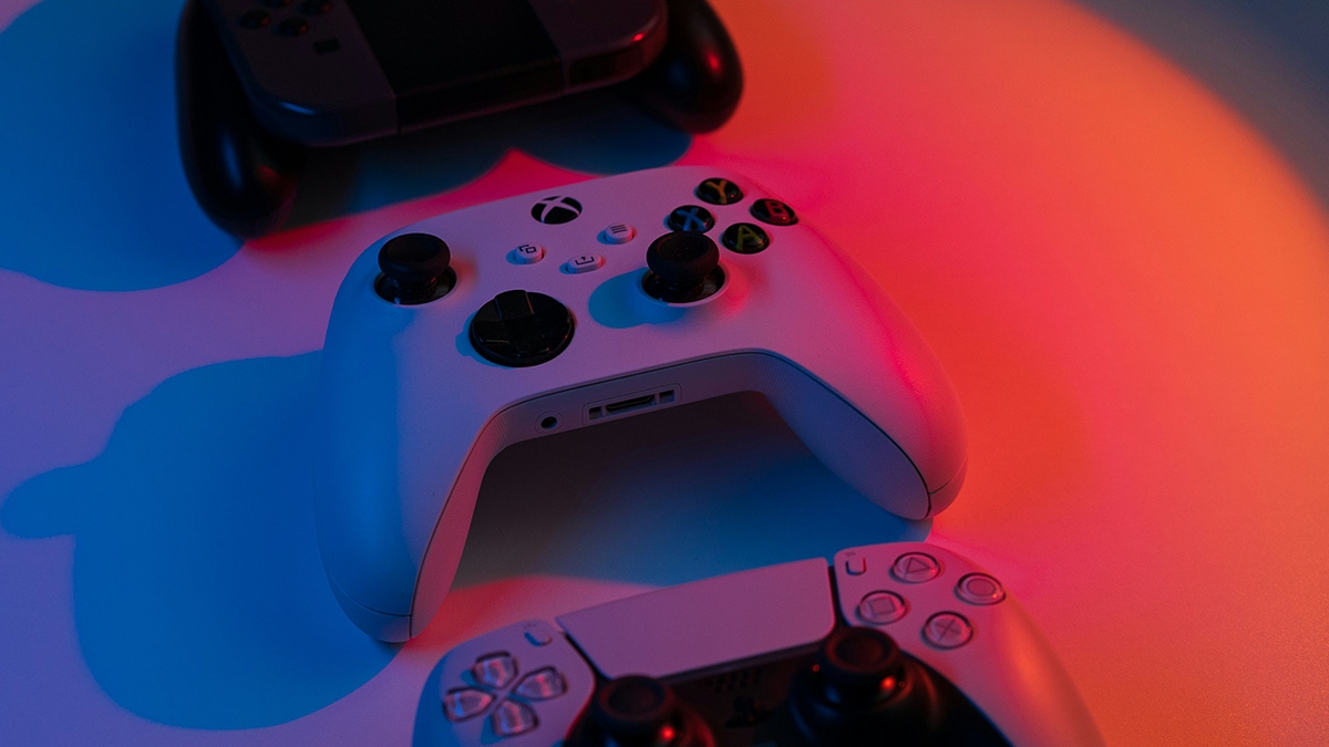 A selection of gamepads on a table A selection of gamepads on a table