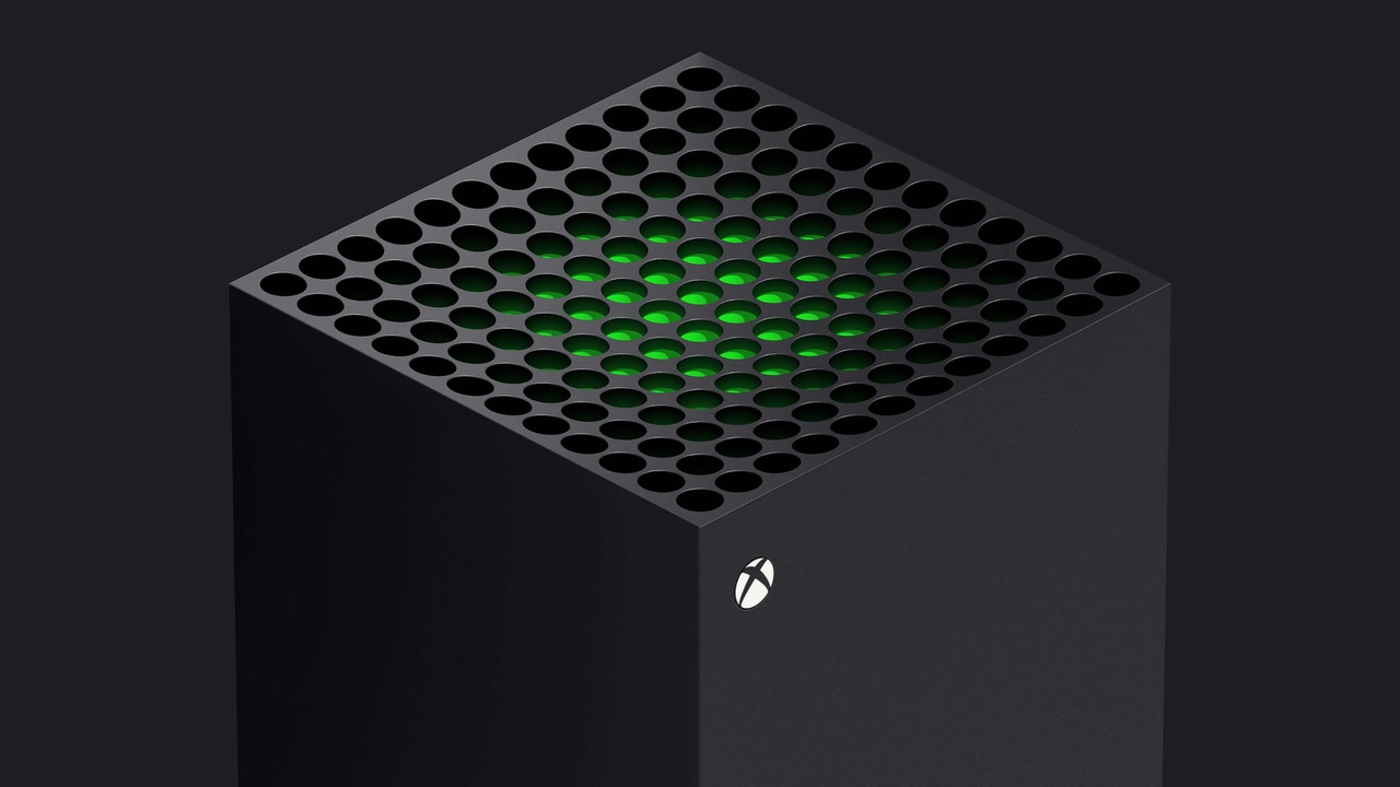 The top half of an Xbox Series X console with a glowing green light inside The top half of an Xbox Series X console with a glowing green light inside