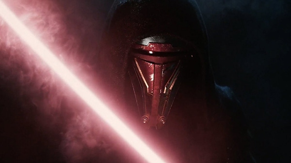 A teaser image for the remake of Knights of the Old Republic. Darth Revan's face is illuminated by a red lightsaber.