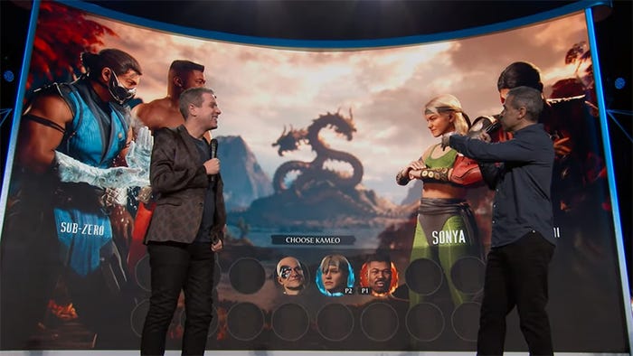 Ed Boon and Geoff Keighley stand in front of a display of Mortal Kombat 1's Kameo Selection screen. Ed Boon and Geoff Keighley stand in front of a display of Mortal Kombat 1's Kameo Selection screen.