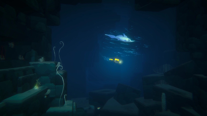 Dave swims alongside a dolphin in Dave the Diver