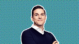 A headshot of EA CEO Andrew Wilson on a stylized background