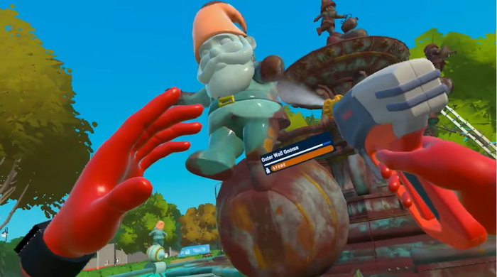 A screenshot from PowerWash Simulator VR. The player sprays down a giant statue of a gnome.