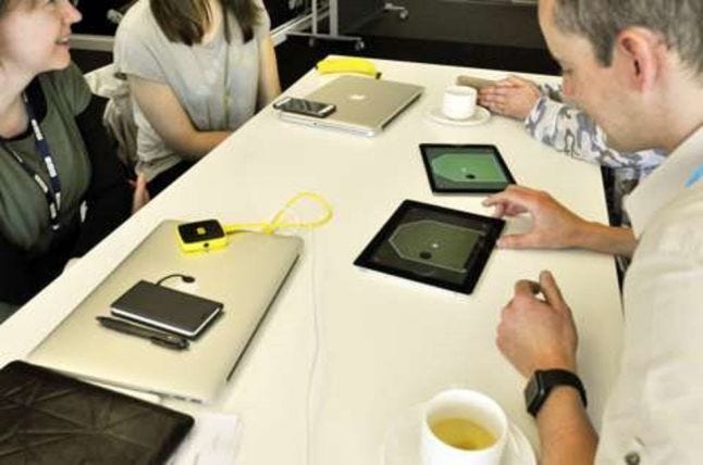 two people playtesting ipad single switch games