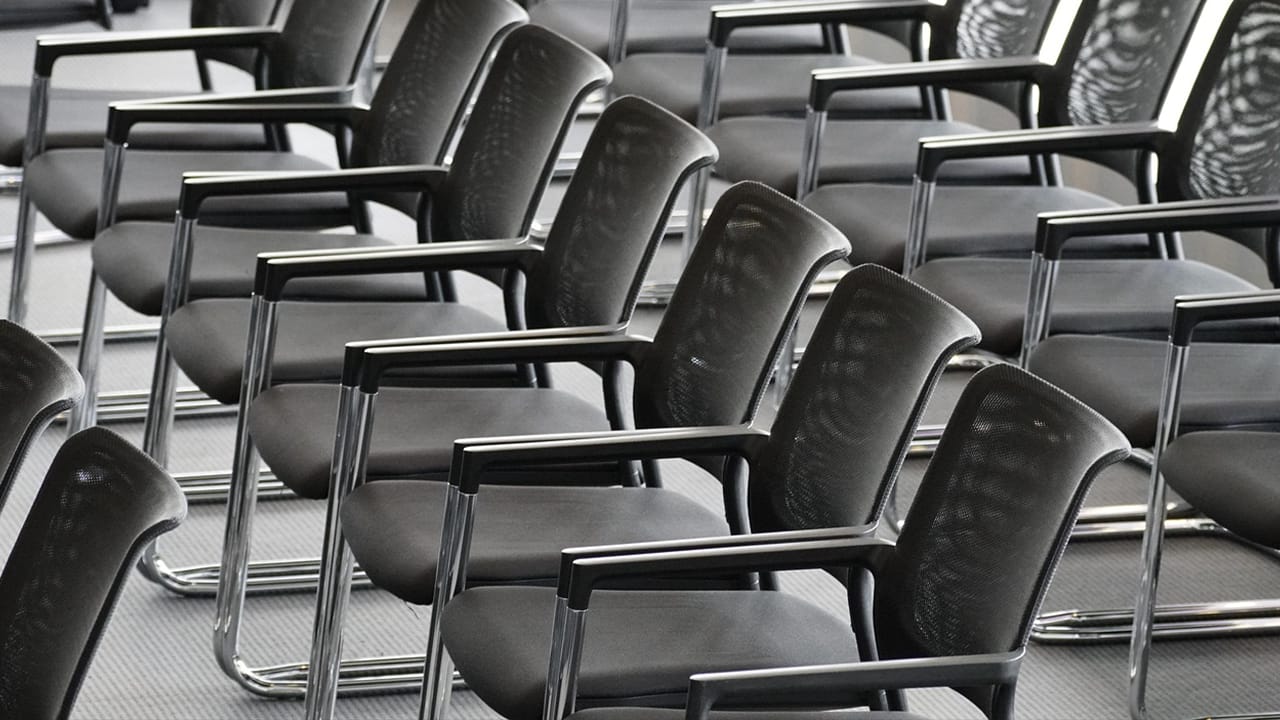 Rows of empty office chairs Rows of empty office chairs