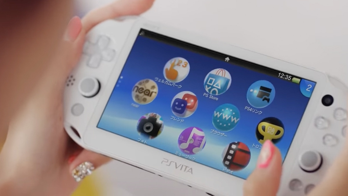 A photograph of the PlayStation Vita in the hands of a player A photograph of the PlayStation Vita in the hands of a player