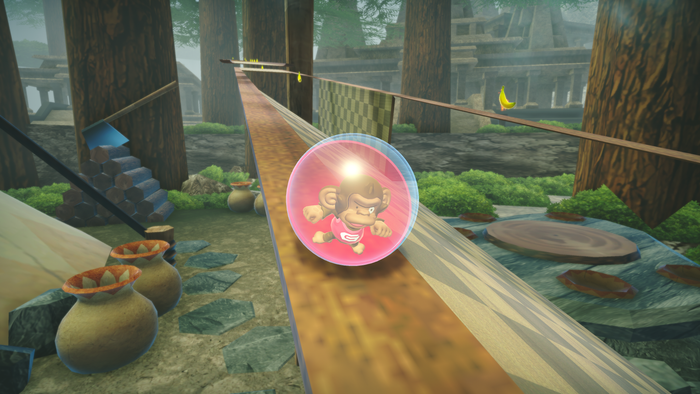The Super Monkey Ball character GonGon rolls down a narrow strip of wood in a forest-set SMB stage.