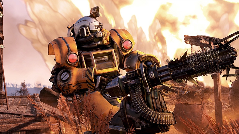 A screenshot of Fallout 76. A person wearing power armor wields a gatling gun. A screenshot of Fallout 76. A person wearing power armor wields a gatling gun.
